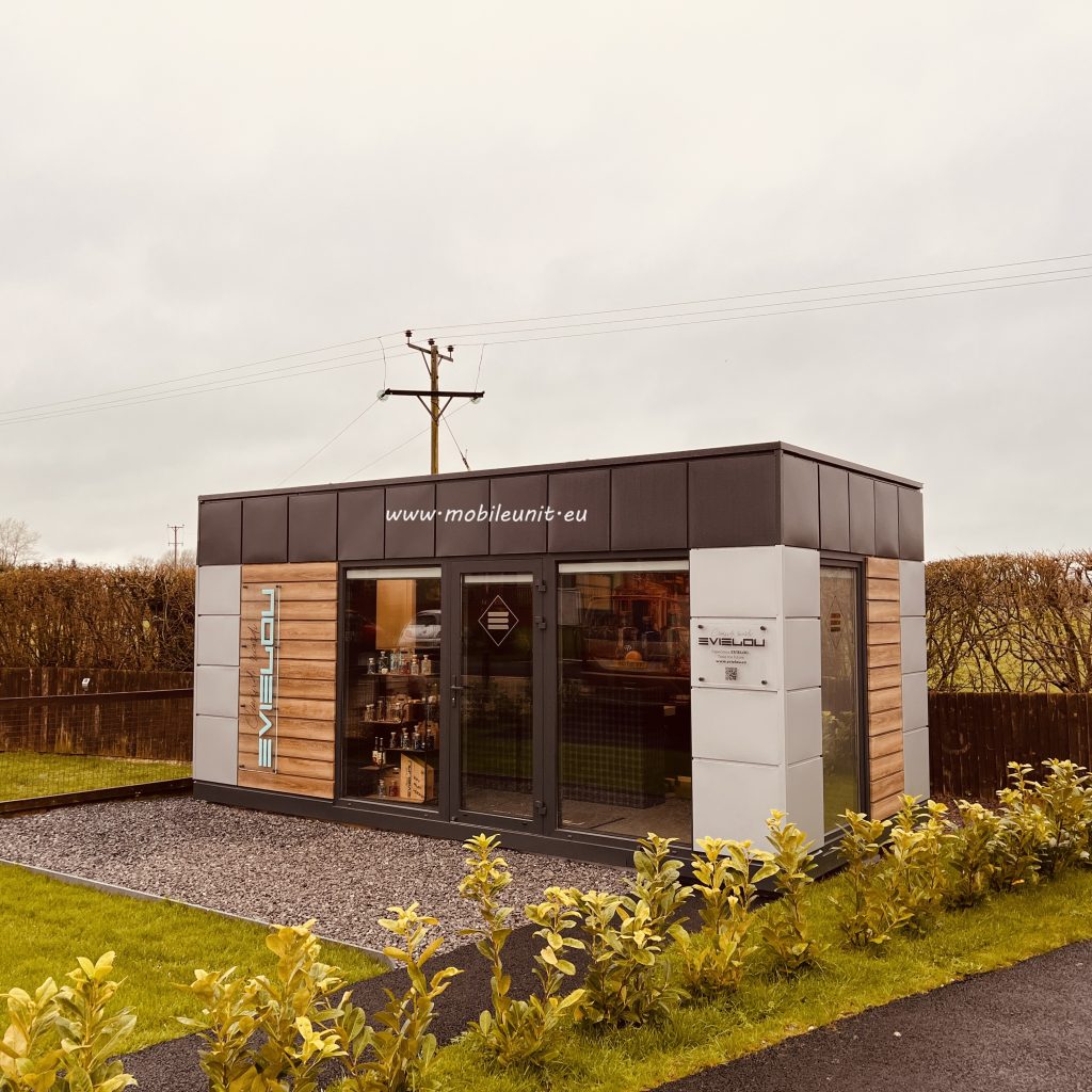 Garden room with timber and white cladding, glazed entrance and modern modular design