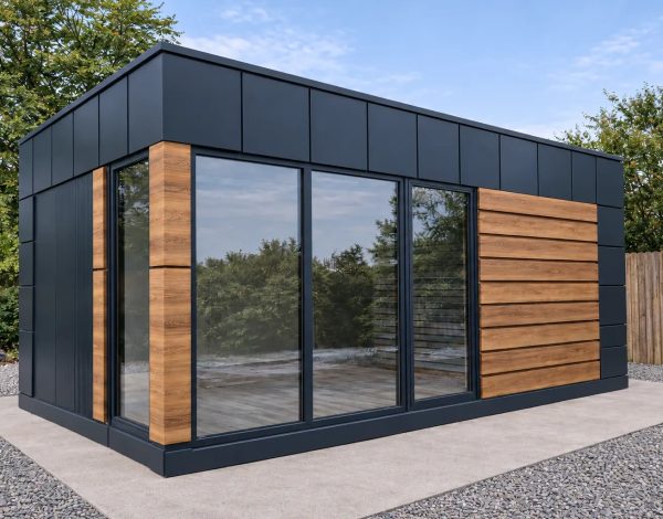 Dark anthracite modular garden office pod with timber horizontal cladding and large sliding glass doors on paved gravel area