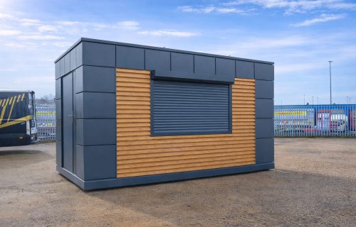 Portable kiosk unit with dark grey panels, horizontal timber slats, and roller shutter serving window